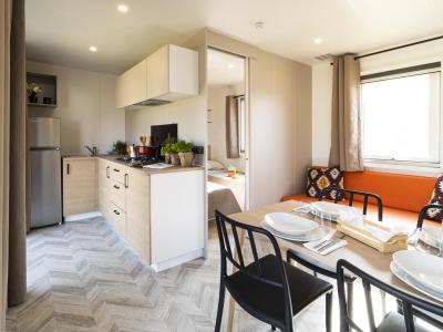 Modern kitchen and dining area in a bright apartment.